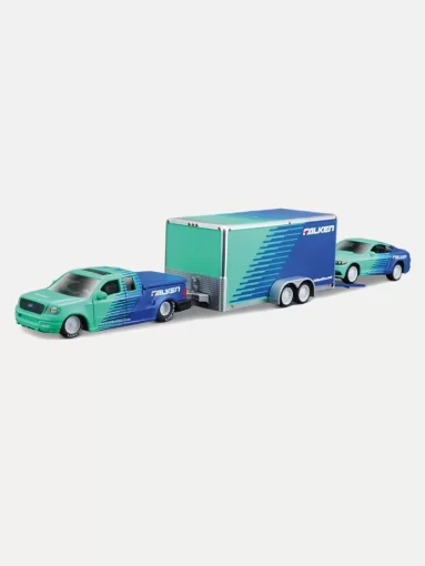 1:64 scale diecast model of a Ford F-150 Raptor tow truck hauling a Falken Tire-liveried Ford Mustang race car on a matching enclosed trailer. Explore our Tow Trucks & Trailers collection.