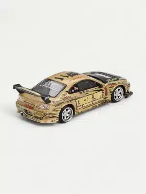 A rear three-quarters view of the Top Secret Gold Nissan Silvia S15 D1GP 1/64 Scale Model, highlighting its functional GT wing and widebody kit.