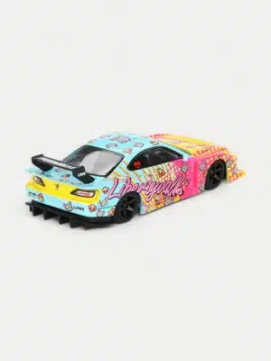 The rear three-quarter view of the 1:64 Liberty Walk Silvia with the KUMA livery, highlighting the massive, separated GT wing and wide rear fenders.