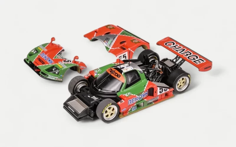 A hero shot of the MOTORHELIX 1/64 Mazda 787B, the rotary-powered 1991 Le Mans Winner, in its iconic Renown livery.