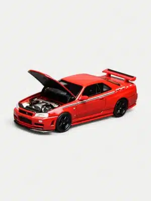 The Motorhelix R34 with detailed engine shown with its hood open via the chassis button, supported by a metal rod, revealing the RB26DETT replica.