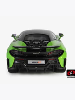 A direct rear view of the 1:18 McLaren 600LT diecast model in green, showing the iconic top-exit exhausts and carbon fiber diffuser.