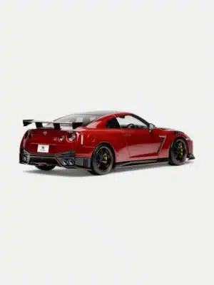 The iconic rear three-quarter view of the Nissan GT-R R35 NISMO model in 1:18 scale, highlighting the signature quad taillights and carbon fiber rear bumper.