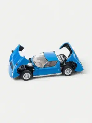 The Tomica Limited Vintage 1:64 Miura P400 diecast model car with its front and rear clamshells open, revealing the detailed transverse V12 engine.
