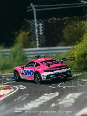 A rear 3/4 view of the 1:64 Tarmac Works Porsche 992 GT3 Cup model, highlighting its large swan-neck wing and rear diffuser.