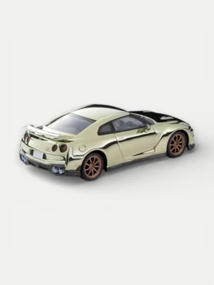 Rear angle of the color-plated Nissan GT-R resting on a hand, highlighting the flawless T-spec 2024 diecast model finish.