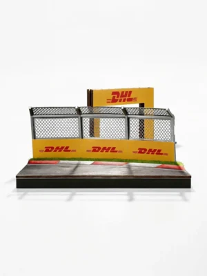 Front view of the 1/64 F1 catch fence diorama showing realistic track kerbs and DHL branding details.