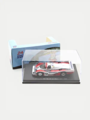 Sparky 1:64 Porsche 956 No.12 diecast with its official Le Mans branded packaging and display case.