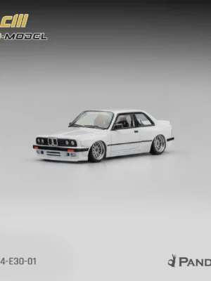 Front angle of the pearl white 1/64 Pandem BMW M3 E30 collector car displaying classic mesh rims and widebody kit.