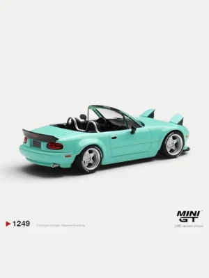 Rear angle of the 1/64 scale Rocket Bunny Miata miniature showing the custom ducktail spoiler, exhaust, and roll bar.