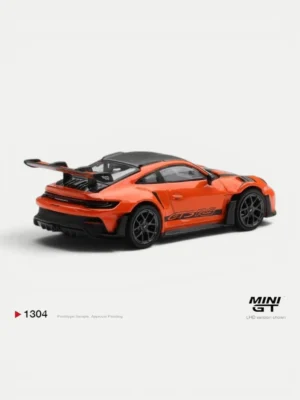 Rear angle of the MINI GT 1304 orange Porsche, a collectible diecast Porsche model featuring the iconic swan-neck wing.