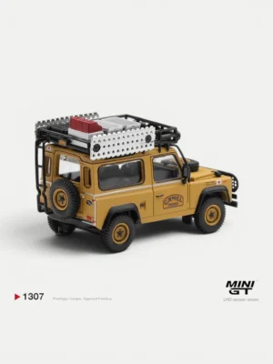 Rear angle of the 1/64 Defender 90 Borneo diecast, showing the Team Japan expedition gear and roof sandboards.