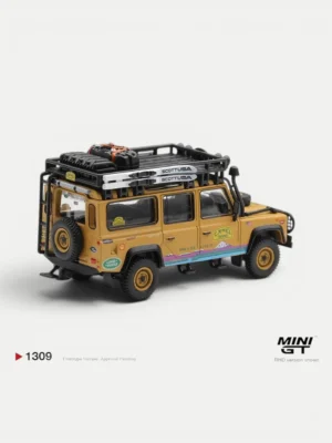 Rear angle of the 1/64 scale Land Rover Defender Camel Trophy diecast, highlighting the ladder, spare tire, and decals.