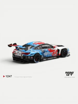 Rear aero details of the Paul Miller Racing BMW M4 GT3 Evo diecast car featuring massive wing and iHeartRadio decals.