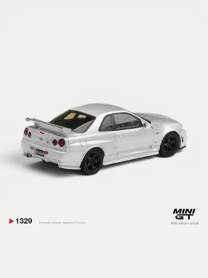 Rear angle of the 1/64 MINI GT Nissan Skyline R34 Z-tune model, highlighting the iconic quad taillights and rear wing.