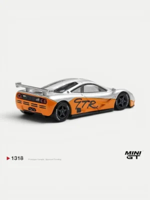 Rear angle of the 1/64 scale McLaren F1 GTR showing the massive racing wing and quad exhausts of this collectible miniature.