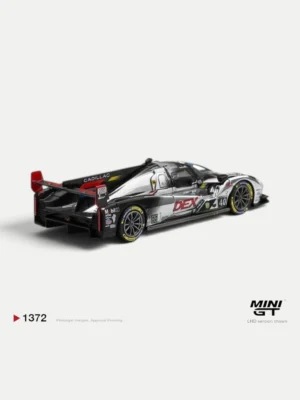Rear angle of the MINI GT Cadillac V-Series.R IMSA prototype, showcasing the massive rear wing and complex diffuser.