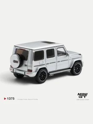 Rear angle of the 1/64 MINI GT Mercedes G63 diecast, highlighting the iconic spare tire cover and boxy SUV silhouette.