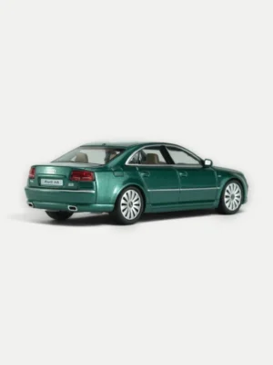 Rear 3/4 view of the 1/64 Audi A8 D3 W12 diecast showing classic taillights, dual exhausts, and Emerald Jade Metallic paint.