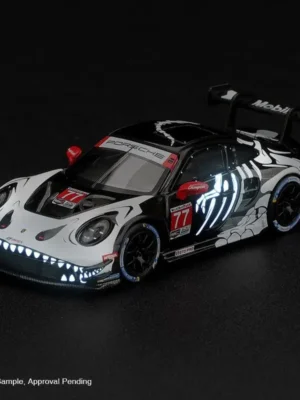 Front view of 1:64 MINI GT 1436 Porsche 911 GT3 R #77 2026 Skeleton Rexy showing luminous grin and claw bones.