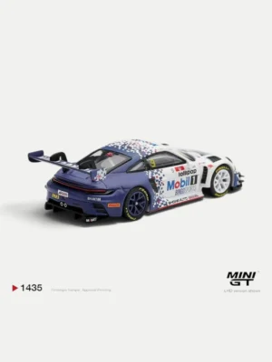 ear angle of the 1/64 Porsche 992 GT3 R diecast by MINI GT, featuring the massive racing wing and detailed rear diffuser.